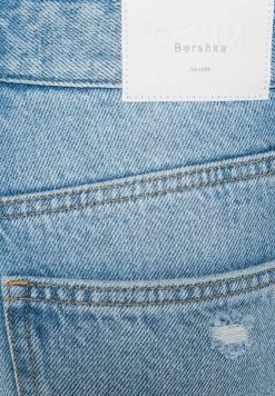 BERSHKA Wide-Leg Ripped - Flared Jeans - Light Blue Denim -Bershka 978c51ccdba843f29ea5f903424b42fe
